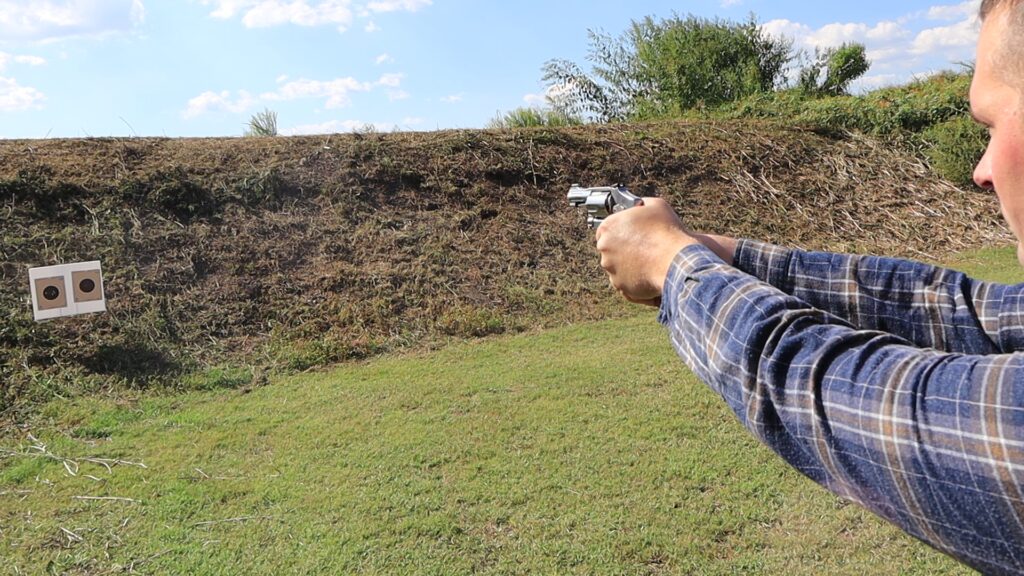 shooting the s&w 940 revolver at a paper target from ten yards